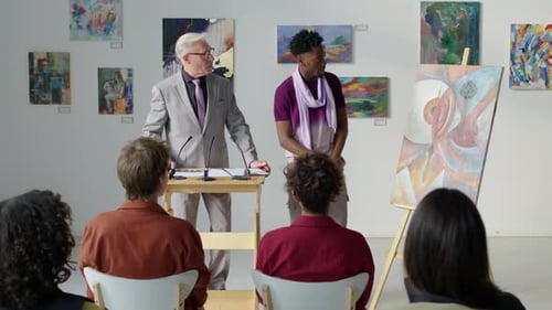 Speaker Congratulates Artist at Gallery Presentation