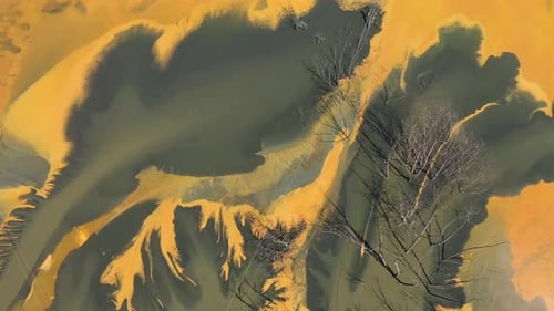 Flying over contaminated mine waters in decanting pond aerial view. Environmental pollution