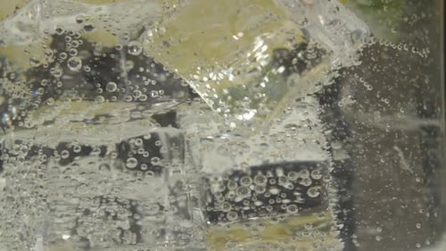 Sparkling Water with Lemon and Ice Cubes