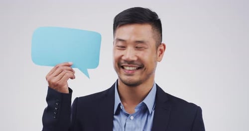 Smiling Man Holding Up Speech Bubble