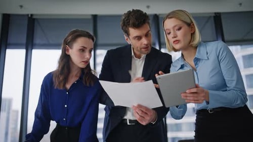 Group Employees Analyzing Documents Data Checking Tablet in Office Closeup