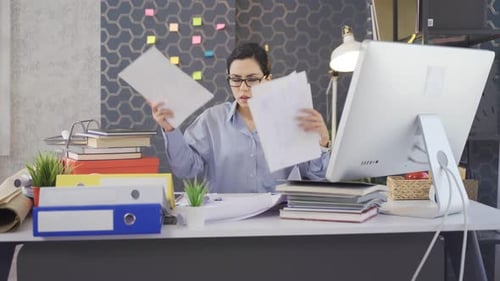 Stressed and tired business woman working in office.