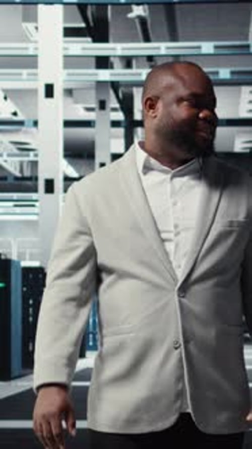 Vertical Video Smiling Manager in Data Center Doing Checkup on Hardware to Avoid Downtime