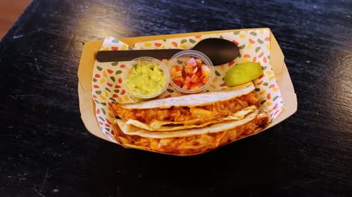 Delicious Chicken Tacos Served with Guacamole and Salsa