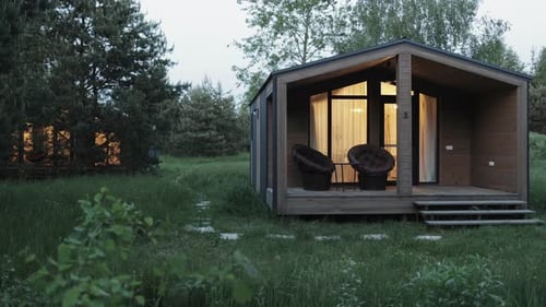 Charming Cabin in a Rural Clearing at Dusk