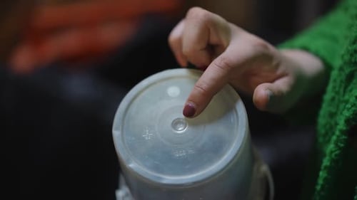 Closeup White Plastic Cap with 5 Pp Symbol and Female Finger Pointing Closeup Used Trash for