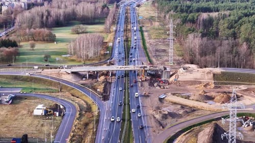 Construction site of viaduct over busy highway road in Europe
