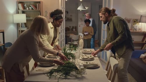 Family Prepares Meal Together in Warm Home Setting