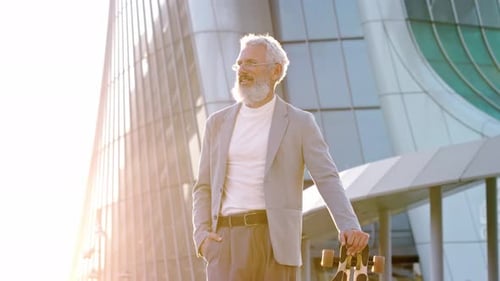 Happy Cool Older Senior Business Man Skater Holding Skateboard in City