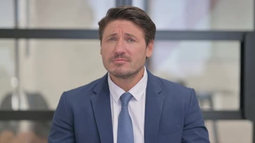 Man in Suit Talking and Gesturing