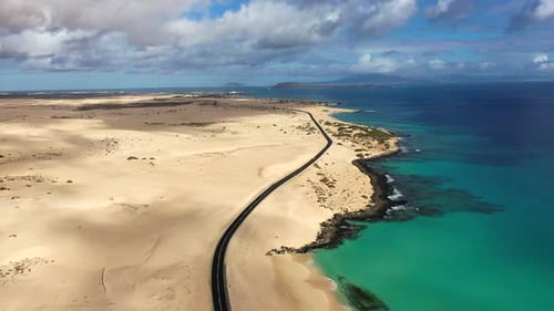 Breathtaking aerial view of coastline and desert landscape during daytime in a remote location