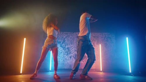 Fulllength Portrait of Couple of Black Dancers Performing Dancehall on Stage African American Man
