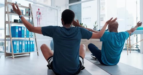 People, yoga and personal trainer in physiotherapy, zen workout or exercise together at clinic