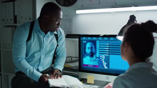 Detectives Reviewing Digital Evidence in an Office