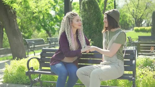 Woman Proposing to Her Beloved Sweetheart with Engagement Ring at Beautiful Park