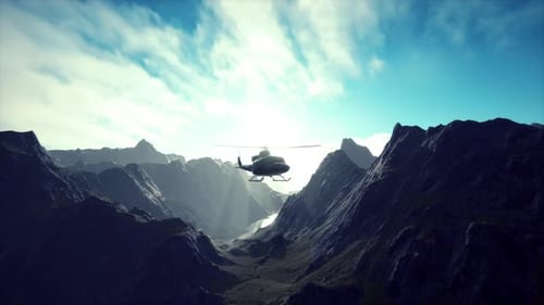 A Helicopter is Flying Over a Mountain Range