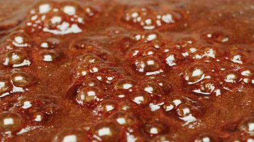 Close Up of Boiling Sugar with Bubbles Turns Into Caramel Caramelization Chef Cooking Dessert in