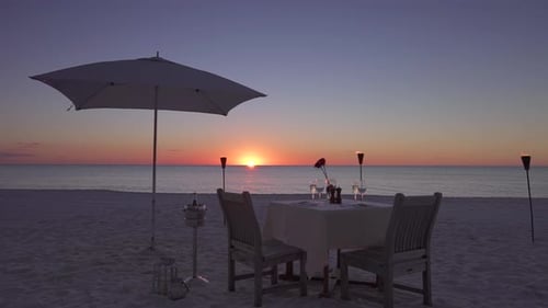 Romantic Table on the Beach Set for Two at Sunset, Tracking