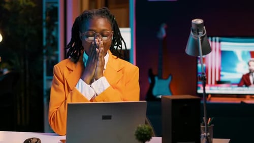 Woman Working at Computer is Tired and Yawns