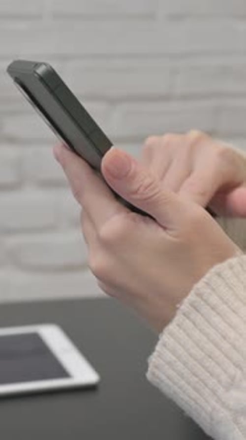 Close up of Woman Using Phone, vertical video
