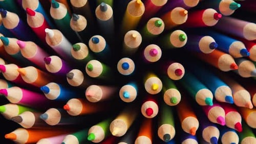 Top View of Sharpened Multicolored Drawing Pencils Rotating in a Circle