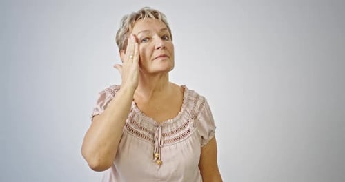 Senior Woman Massaging Face for Skincare