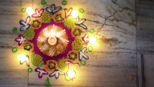 Vibrant Rangoli Pattern with Candles for Diwali Festival