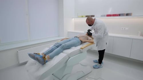 Medical Professional Working on Patient in Clinic