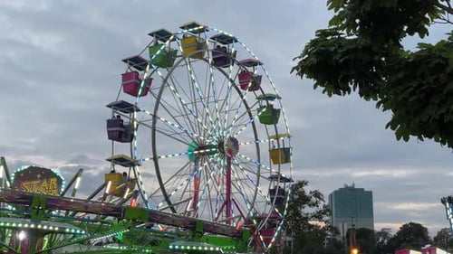 Amusement Park Roller Coaster and Ferris Wheel at Sunset in Dartmouth Canada