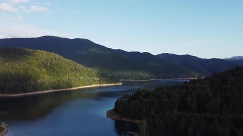 Landscape aerial shot of nature in Europe. Mountains with forest and river