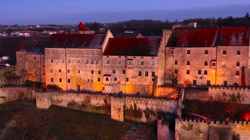 Aerial drone view at night of multiple modern and old buildings 02 4k