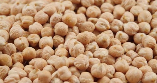 Raw Chickpeas Close-up Rotating, Selective Focus. Food Background. Vegetarian Healthy Organic Food