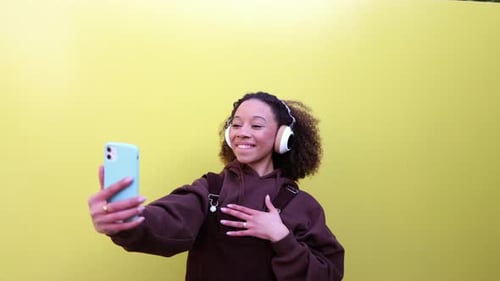 Cheerful Woman Taking a Selfie with Smartphone