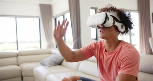Young Adult Using Virtual Reality Headset at Home