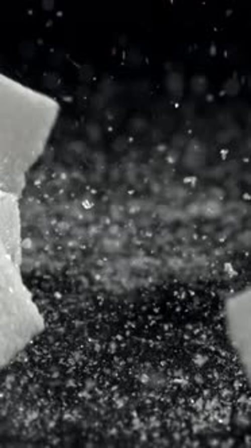 Sugar Cubes Fall on the Table Filmed on a Highspeed Camera at 1000 Fps