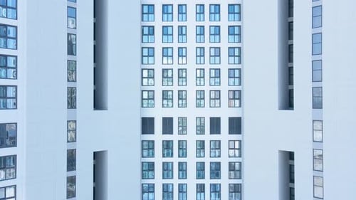 Modern white building of residential complex, urban geometry.