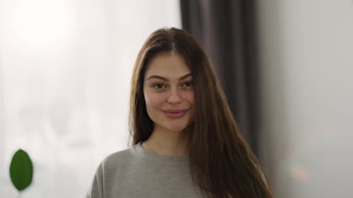 Happy Young Woman Smiling Indoors Portrait
