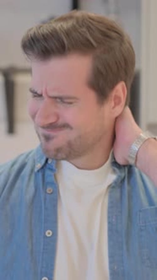 Man Massaging His Neck Due to Pain