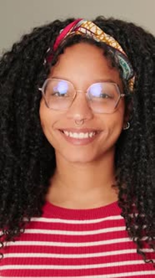Smiling Young Woman with Curly Hair Portrait