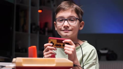 Boy Plays a Classic Retro Video Game