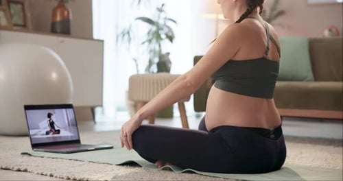 Pregnant Woman Doing Yoga at Home