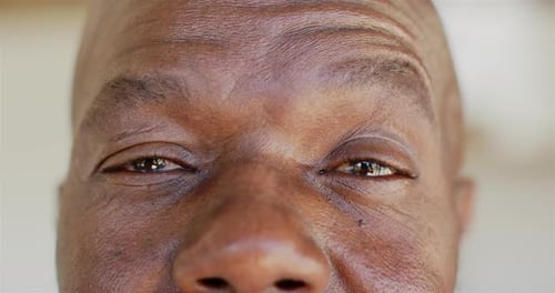 Close-up of mature man's eyes and forehead, showing wisdom and experience