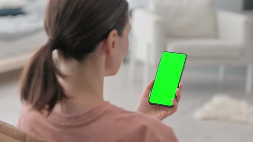 Woman Using Chroma Key Smartphone at Home