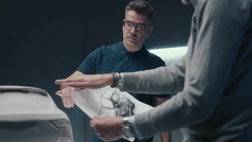 Men Discussing Car Design in Modern Studio