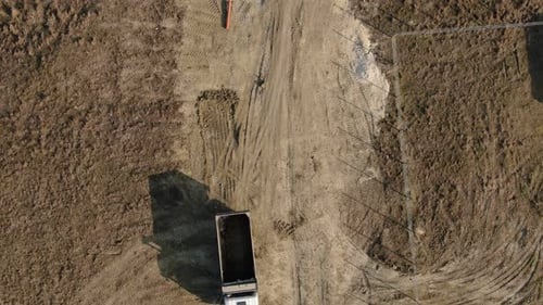 Aerial View of a Truck with an Empty Body on a Dirt Road