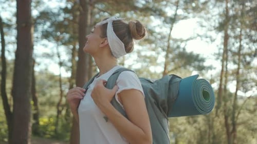 Close Up Young Woman Tourist with Backpack Walking in the Fall Forest on Sunny Summer Day Smile Look