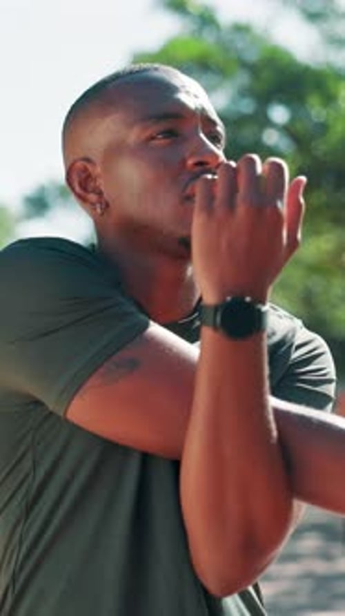 Man Stretching Arms Before Fitness Activity Outdoors