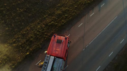Aerial View: Rescue Team of Firefighters and Paramedics Work on a Car Crash Traffic Accident Scene.