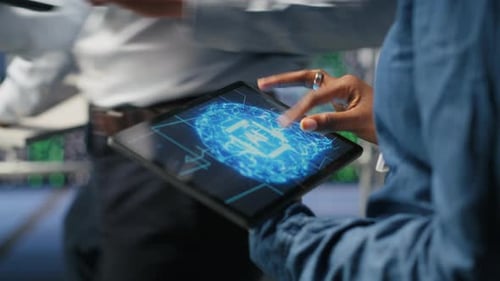 Close Up of Data Center Engineer Using Tablet Doing Maintenance on AI Rigs