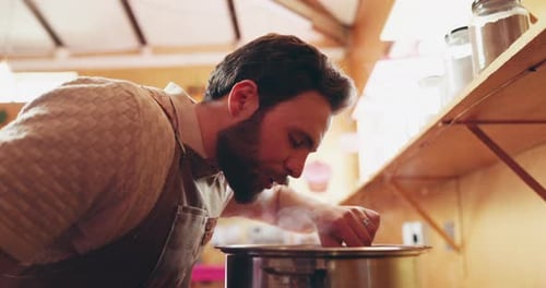 Man Cooking Food in a Kitchen